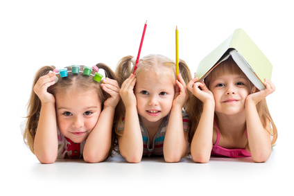 kids with book, pencils and paints on their heads